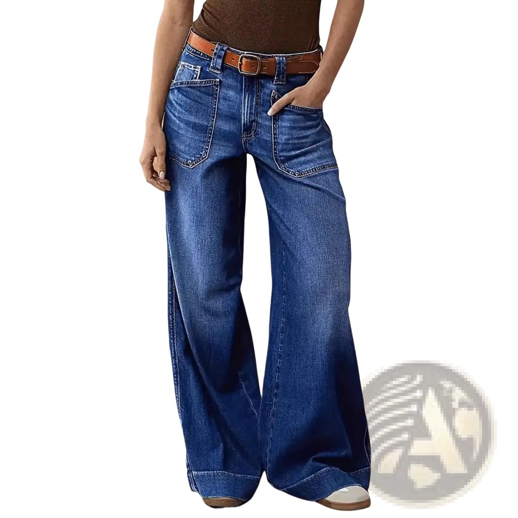 Wide leg denim pants in blue with a brown leather belt made from high quality denim material