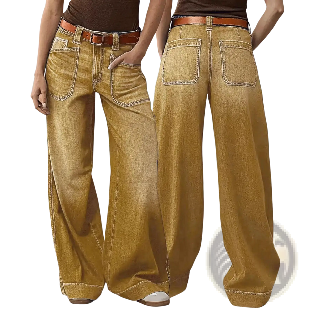 Wide leg denim pants in golden yellow with contrasting stitching and a brown leather belt