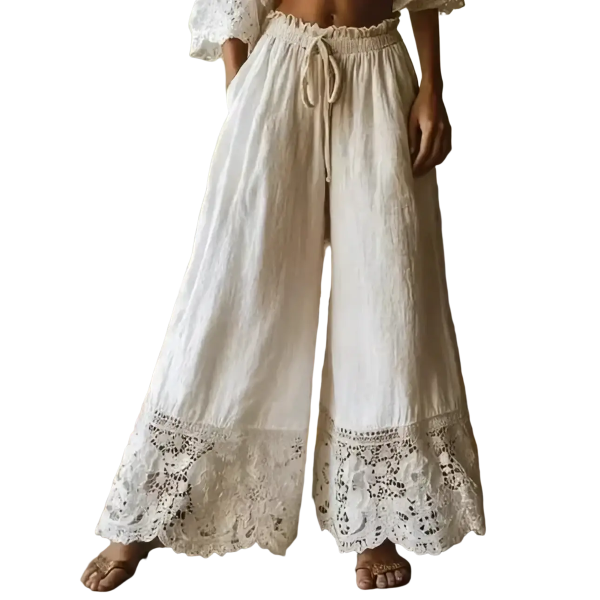 Cream-colored wide leg linen pants with elastic waist and delicate lace trim at the hem
