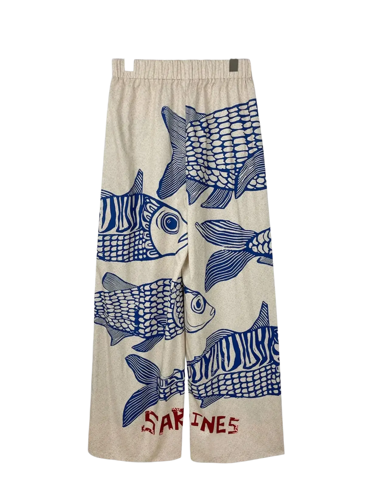 Beige wide leg pants with a bold blue fish print and elastic waist featuring sardines text in red at the bottom