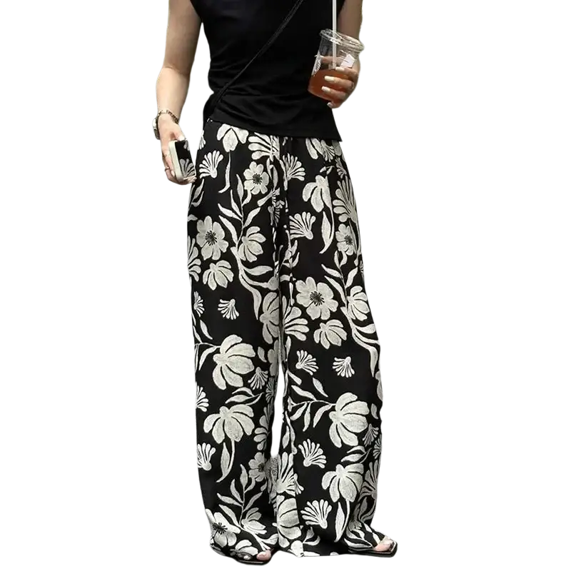 Wide leg floral pants for women in black and white featuring a bold floral print and a comfortable wide leg fit
