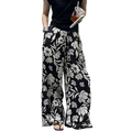 Black wide leg pants for women featuring a bold white floral pattern perfect for stylish casual wear