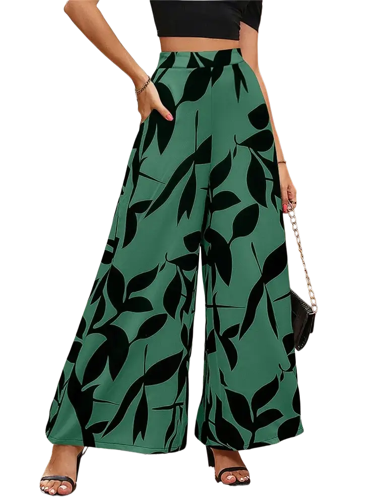 Green wide leg floral summer palazzo trousers with bold black leaf pattern perfect for warm weather wear
