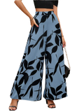 Light blue wide leg palazzo trousers with bold black leaf pattern ideal for summer casual wear
