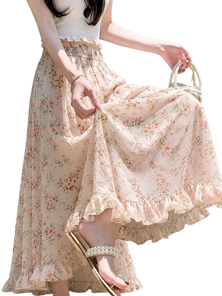 A flowing pale pink wide leg floral summer pants with delicate ruffled hem and waistband for women