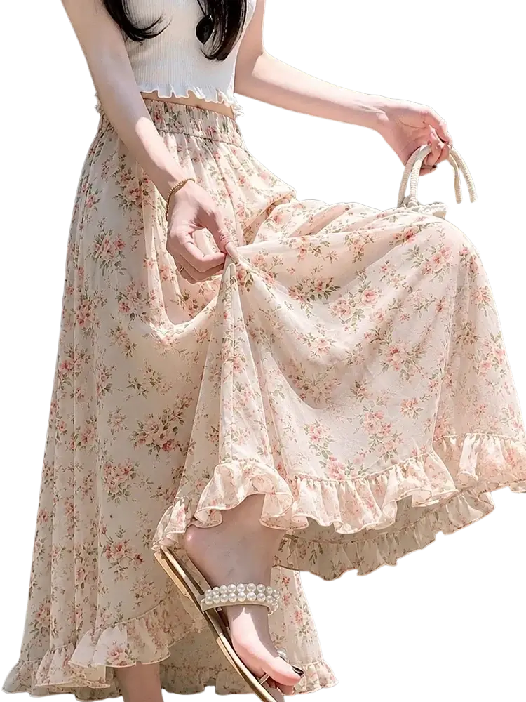 A flowing pale pink wide leg floral summer pant with delicate ruffled hem and waistband for women
