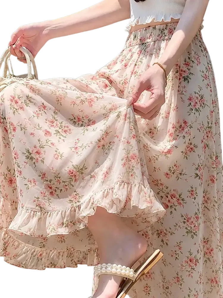 A flowing pale pink wide leg floral summer pant with delicate ruffled hem made of soft chiffon fabric