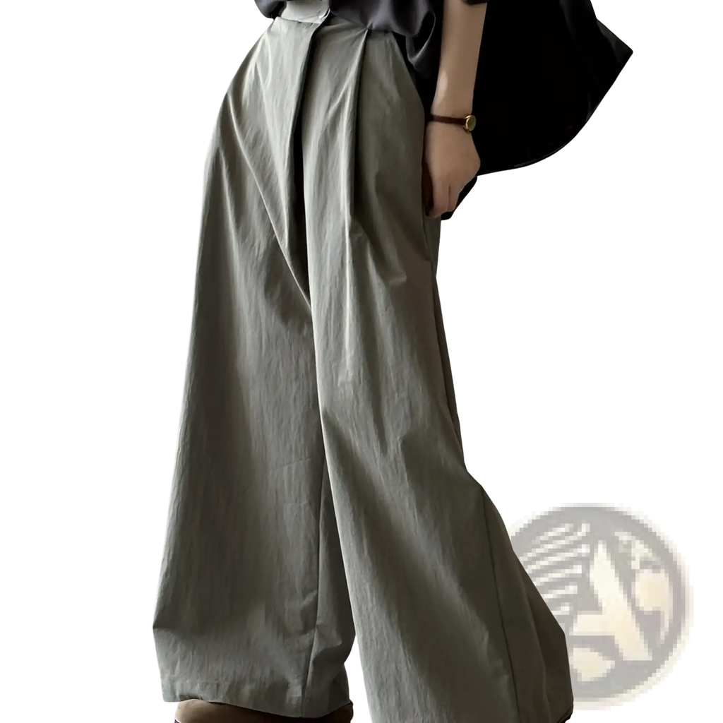 Gray wide-leg high waisted casual trousers with a relaxed flowing silhouette and subtle pleats at the waist