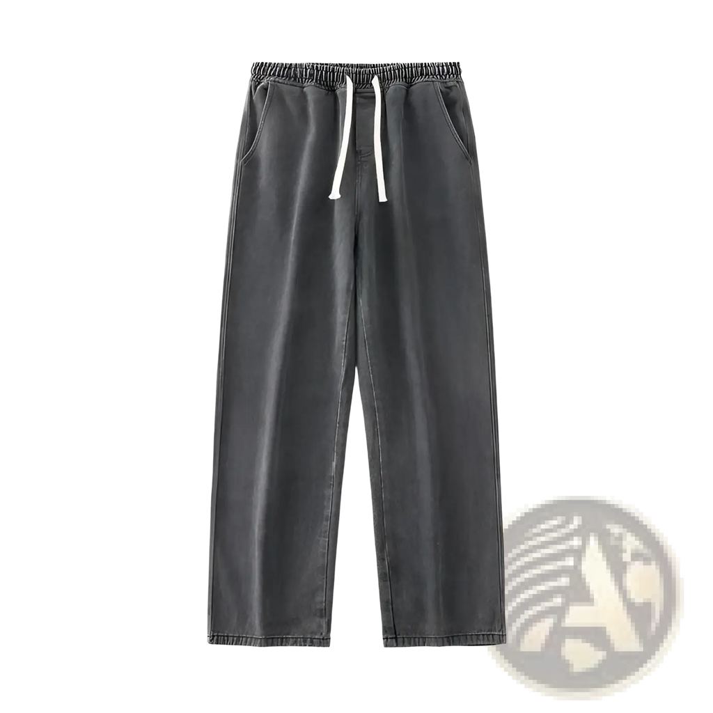 Dark gray relaxed-fit jogger pants with drawstring waist and white cord accents for casual streetwear use