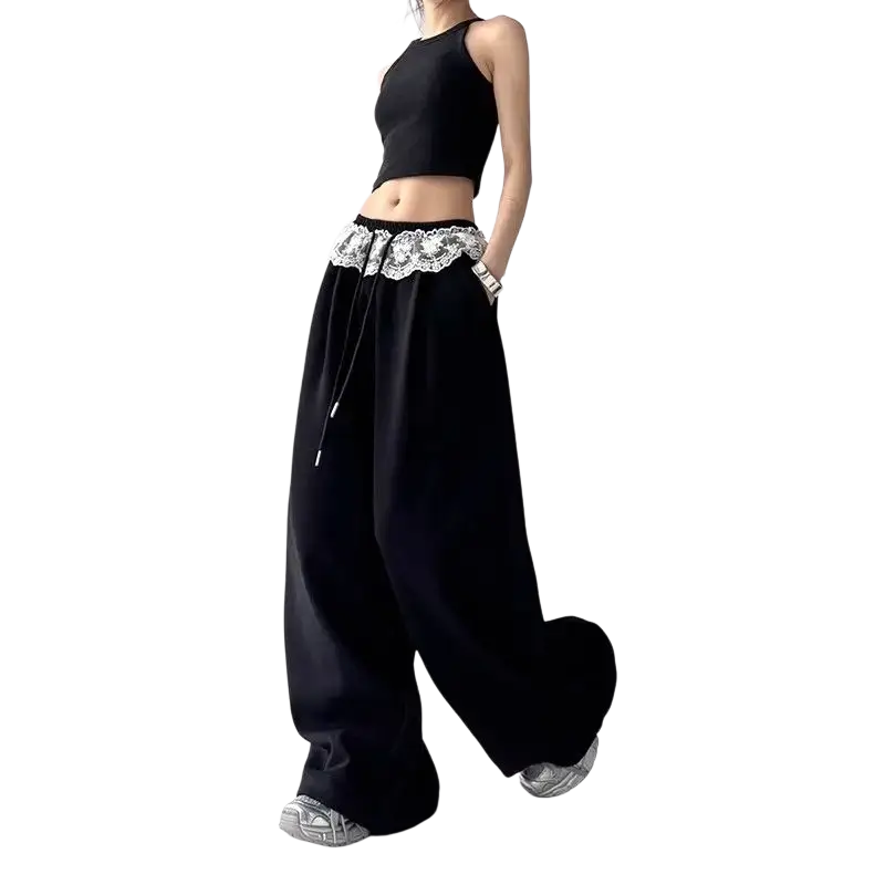 Wide leg chiffon pants in black featuring a delicate white lace trim at the waistband modname=ckeditor