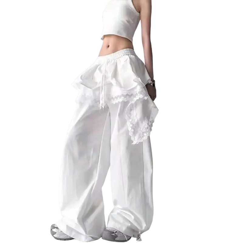 White satin wide leg pants featuring ruffled lace detailing at the waist in elegant trousers design