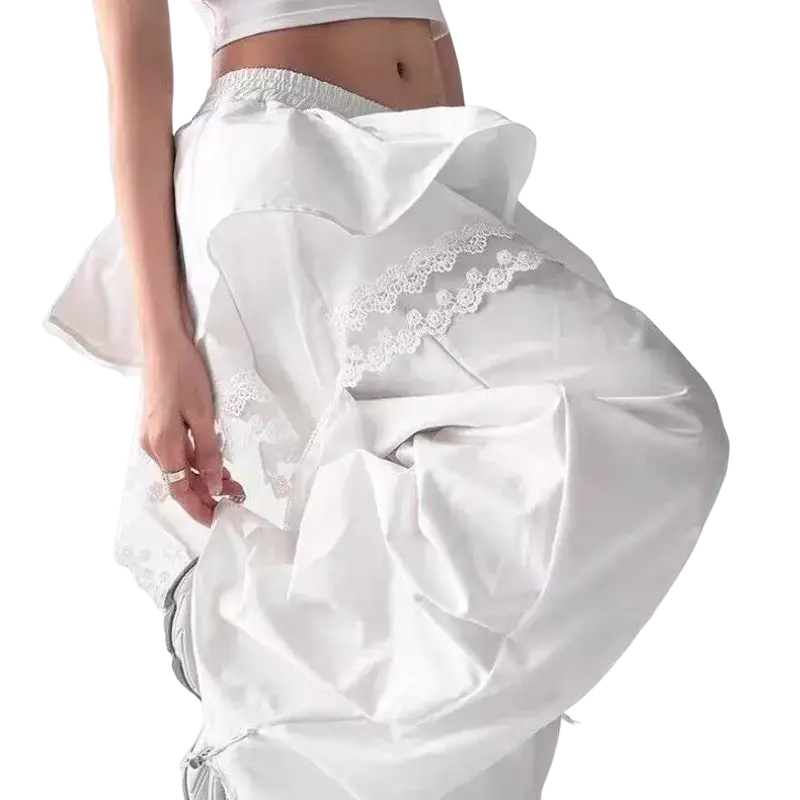 White satin wide leg trousers with delicate lace trim and a flowing, voluminous silhouette