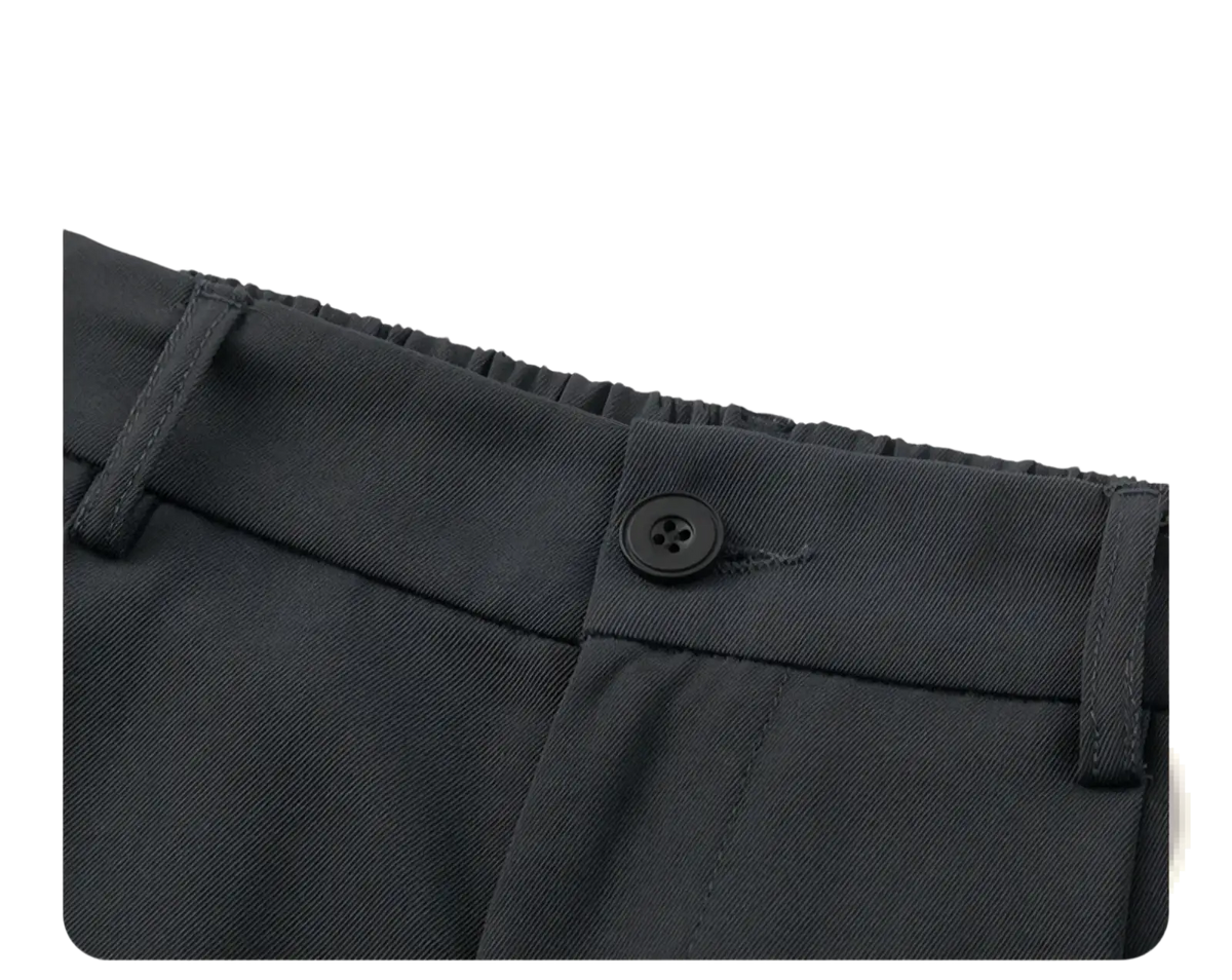 Wide leg mens suit trousers in black woven fabric with a loose fit and single black button at the waistband