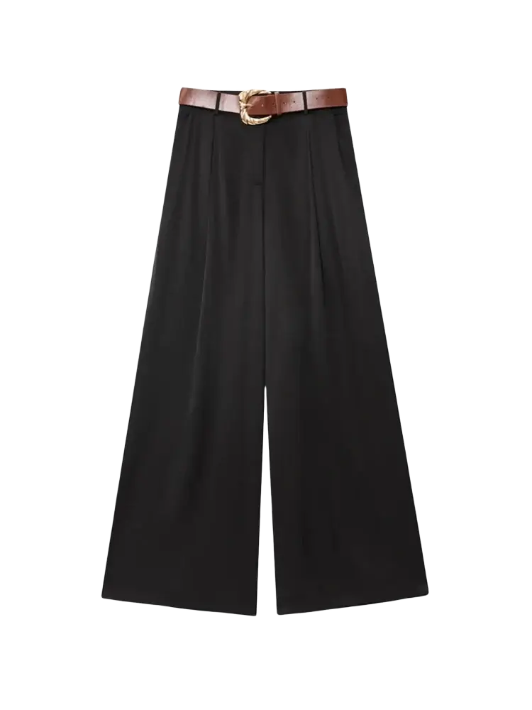 Wide leg black trousers for women with a brown leather belt featuring an ornate gold toned buckle