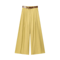 Yellow wide leg pants for women featuring a brown leather belt with a gold toned buckle