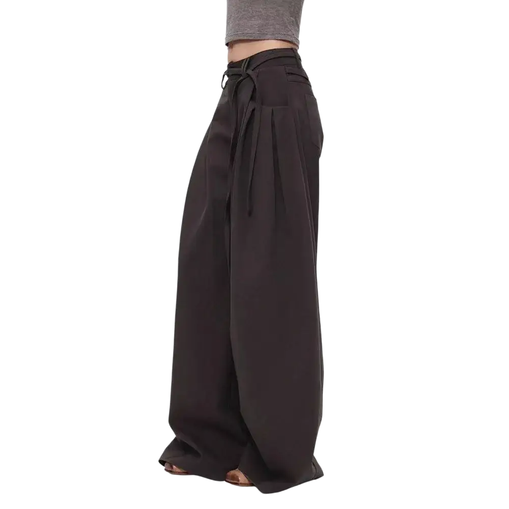 Black wide leg pants with high waist and tied waistband made of soft flowing fabric for elegant wear