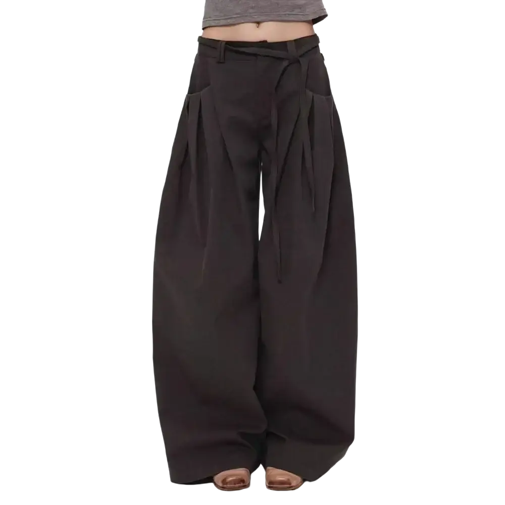 Black wide leg pants with a tied waistband and prominent pleats for a high waist flowing look