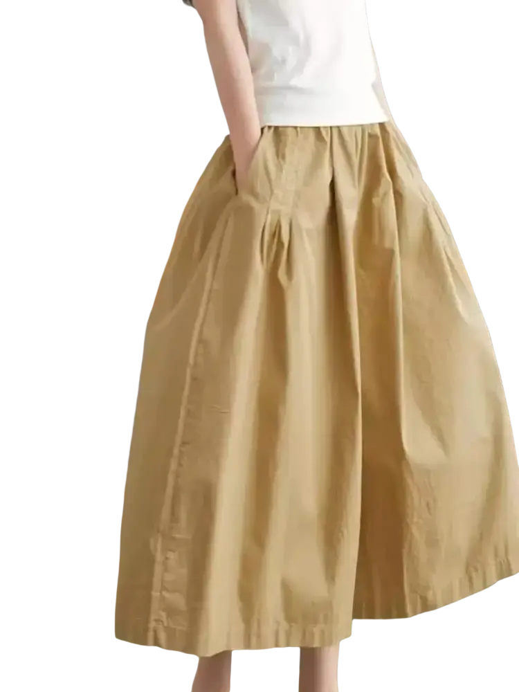 Beige cotton wide leg skirt pants with subtle pleats and relaxed fit midi length for casual wear