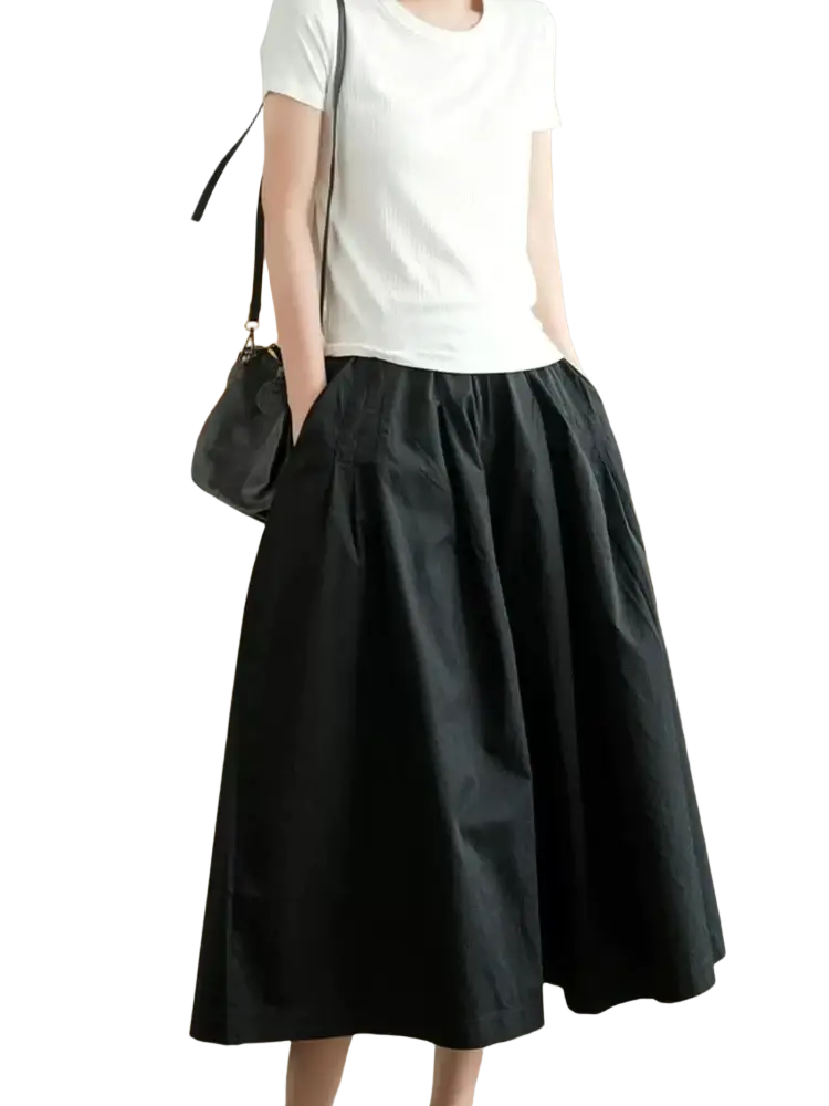 Black cotton wide leg skirt pants with pleated midi length and flowing a-line silhouette for casual wear