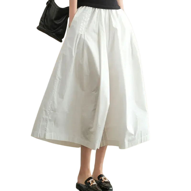 White flowing midi skirt pants with wide leg design cotton material and relaxed fit with subtle pleats