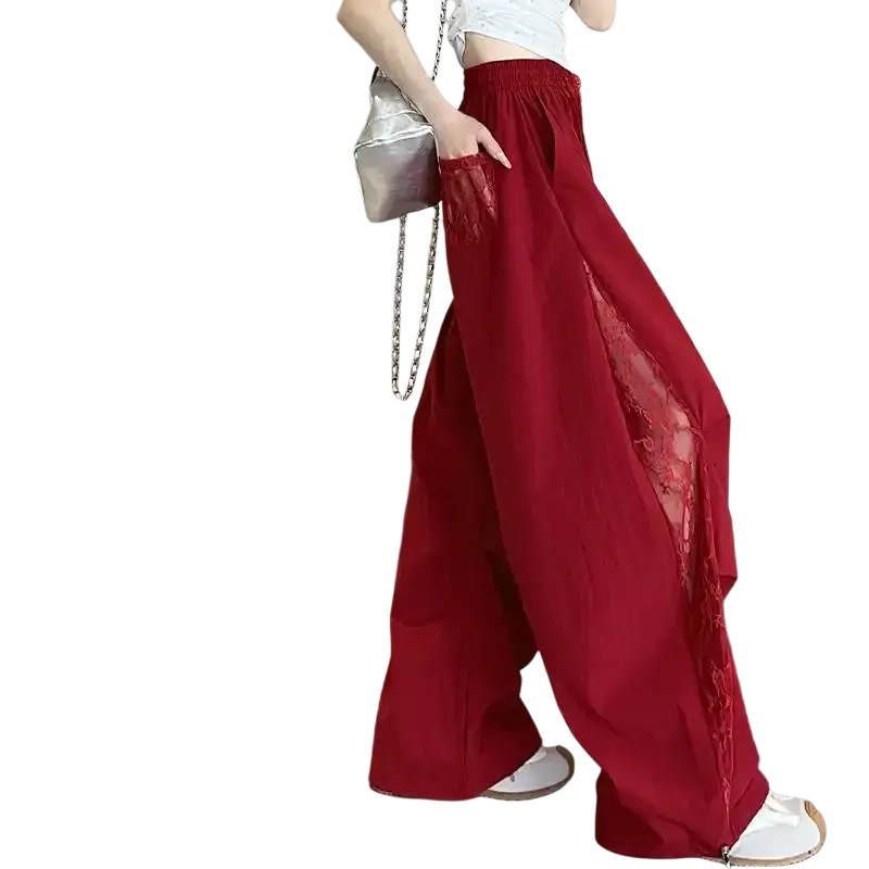 Red wide leg pants with elastic waist and sheer lace side panels showcasing stylish and comfortable design