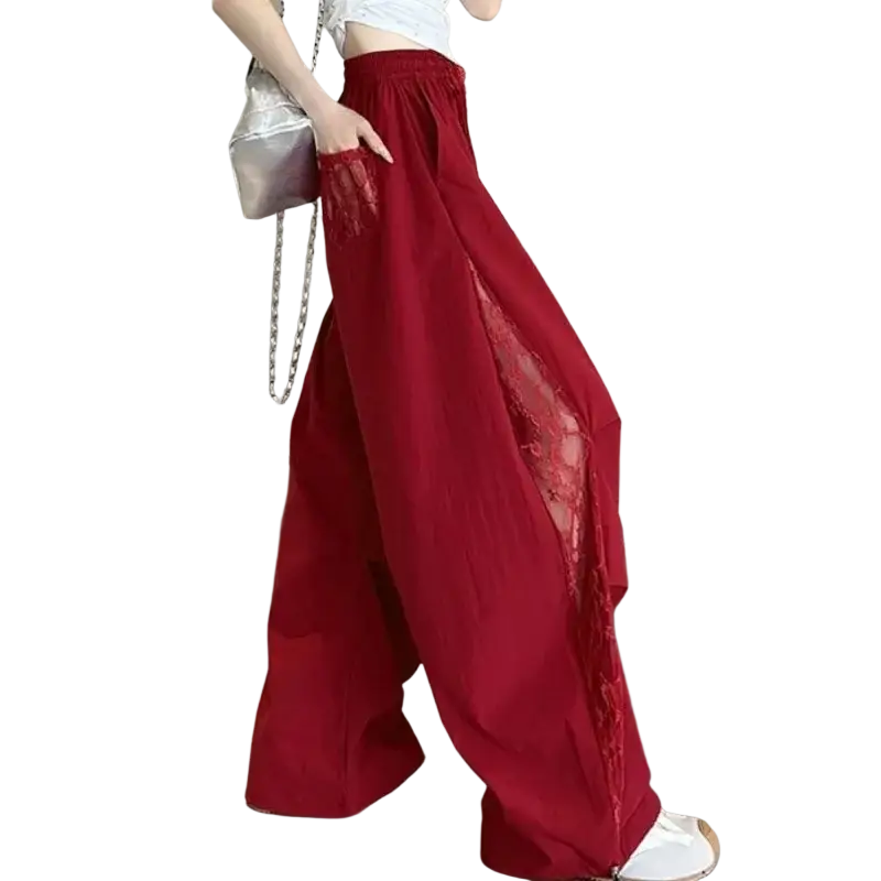 Red wide leg pants with elastic waist and sheer lace side panels for a stylish and comfortable fit