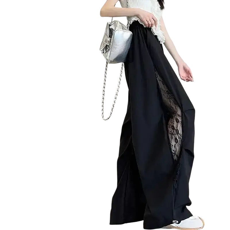 Silver metallic chain shoulder bag with structured rectangular body and visible stitching complements wide leg elastic waist pants