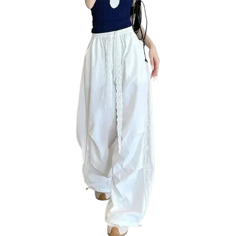 White wide leg pants with elastic waist featuring delicate lace trim along the side seams modname=ckeditor