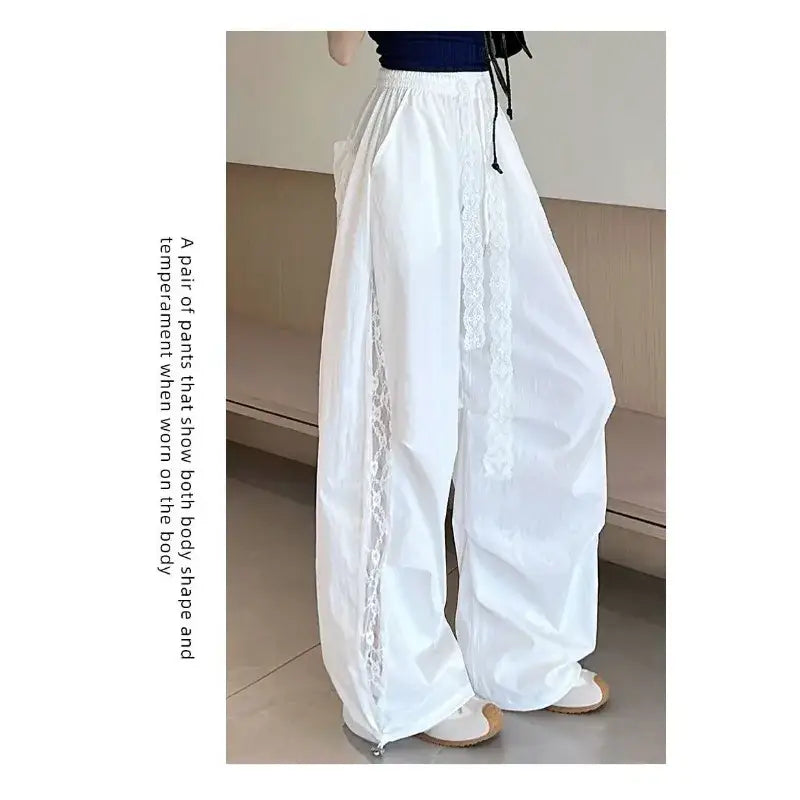 White wide leg pants with elastic waist and delicate lace trim along the side seams modname=ckeditor
