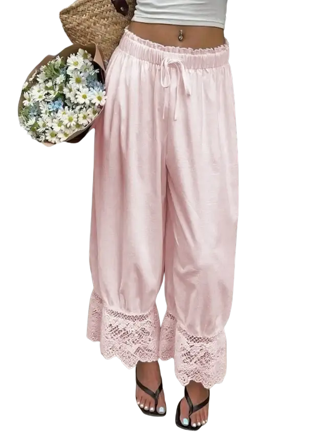 Soft pink wide leg pants with delicate lace trim at the hem perfect for casual wear and comfort
