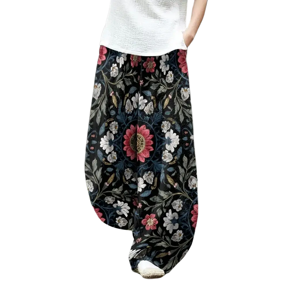 Wide leg pants in black fabric with vibrant pink and white floral print perfect for boho casual wear