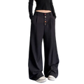 Black high waist wide leg pleated pants featuring colorful button details down the front