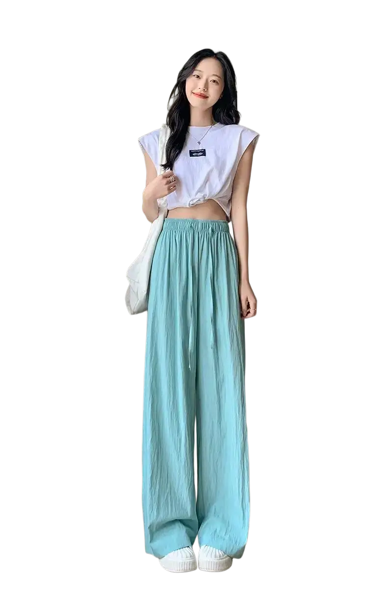 A pair of light blue wide leg pleated trousers for women with elastic waistband ideal for summer wear