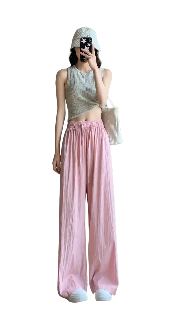 Pink wide leg pleated trousers for women with soft flowing fabric and elastic waistband summer pants