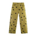 Olive green denim wide leg high waist pants with bold black polka dot pattern for stylish casual wear