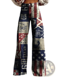 High-waisted wide leg printed denim jeans with vintage nautical and american flag patchwork in faded blue red white and gray