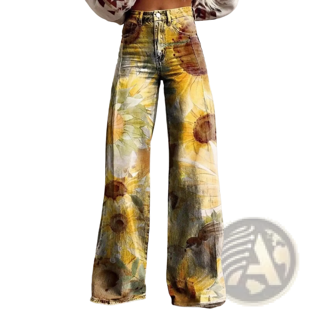 Wide leg printed denim jeans featuring a vibrant sunflower print in yellow green and brown tones