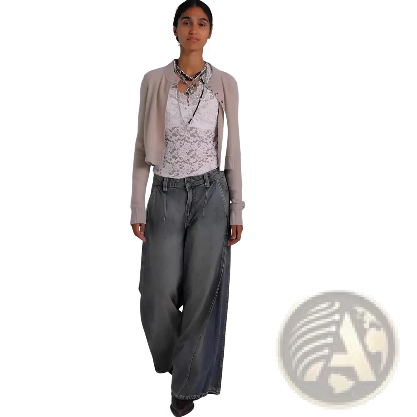 A woman wearing vintage blue wide leg retro denim jeans paired with a beige cropped cardigan and white lace top