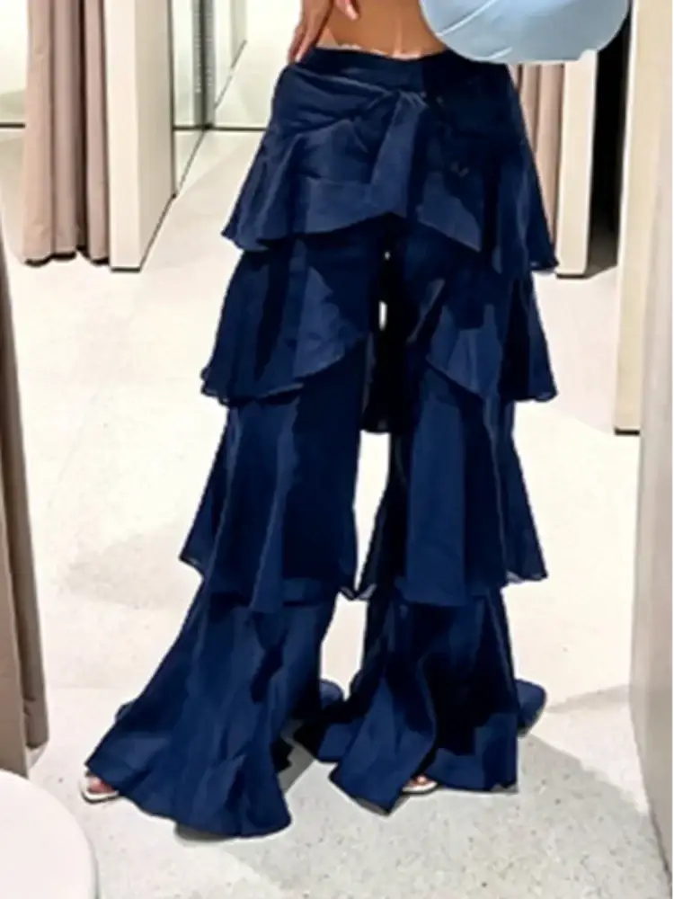 Deep navy blue wide leg ruffled high waist pants with layered flowing fabric for Y2k streetwear style