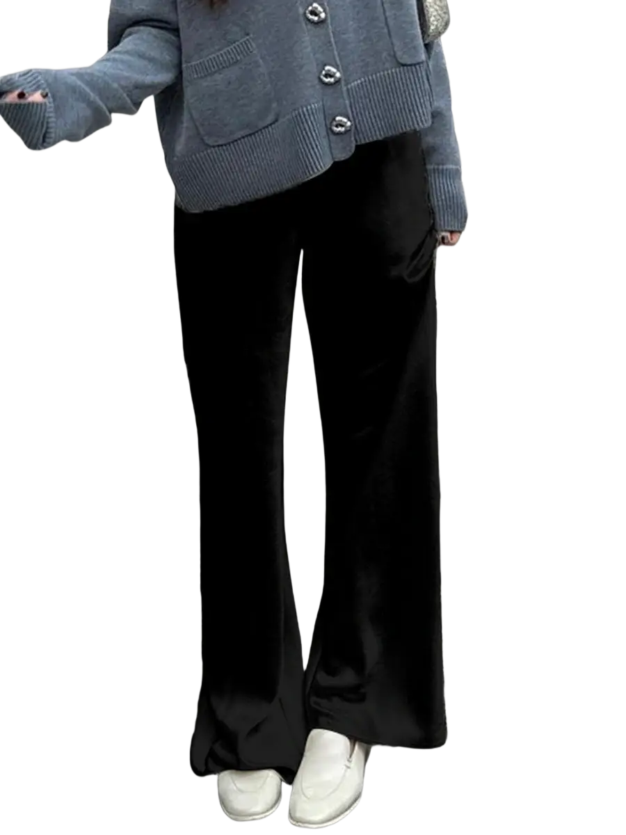 Black velvet wide leg trousers with elastic waist and sleek flowing silhouette showcasing pants length and wide leg design