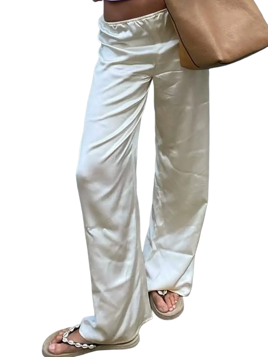 Cream wide leg satin pants with elastic waist and flowing relaxed pants length in satin material