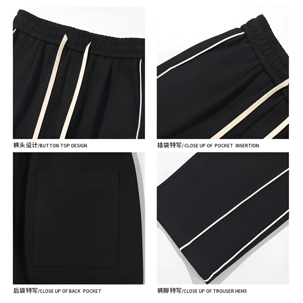 Black wide leg striped track pants with white side stripes and button-top waistband for athletic use