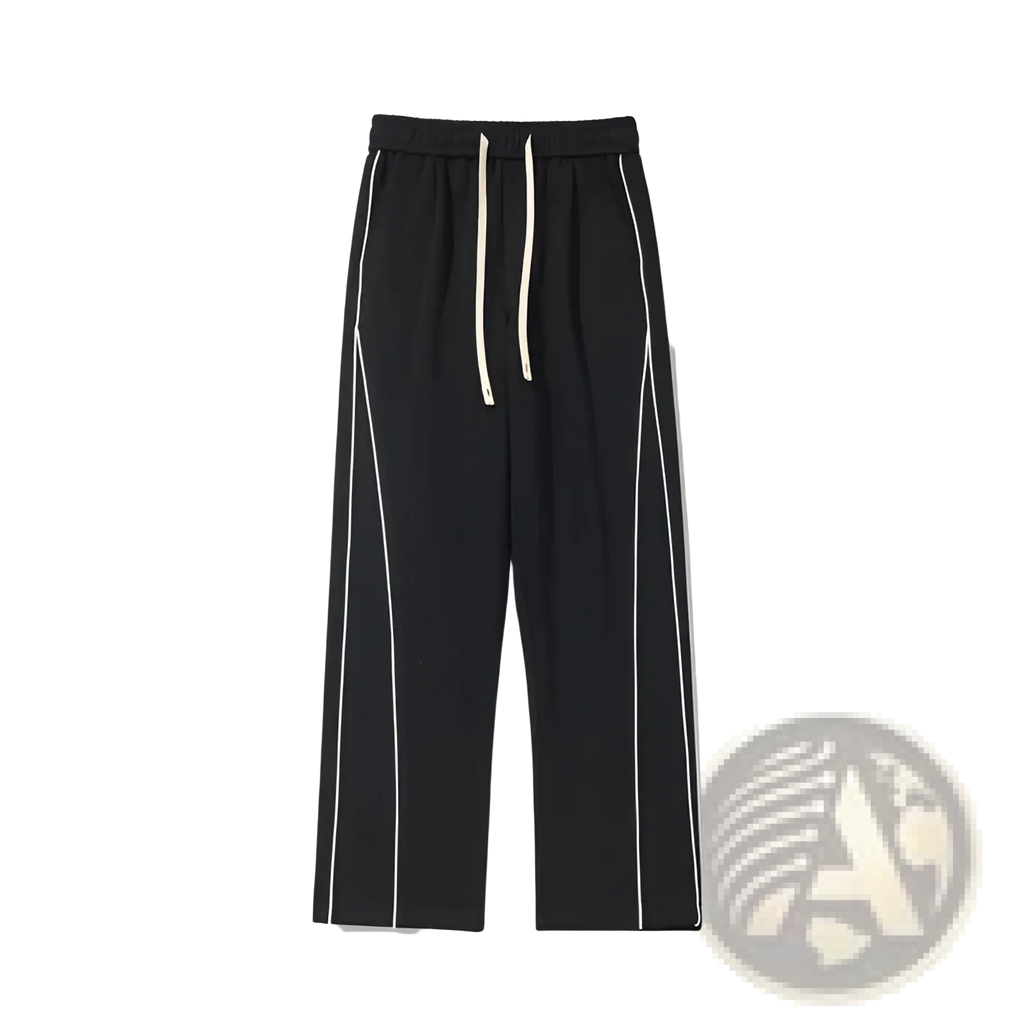 Black wide leg striped track pants featuring white side stripes and a matching drawstring waistband for comfort