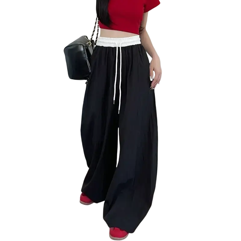 Black wide leg sweatpants for women with white elastic waistband and matching drawstring for casual comfort