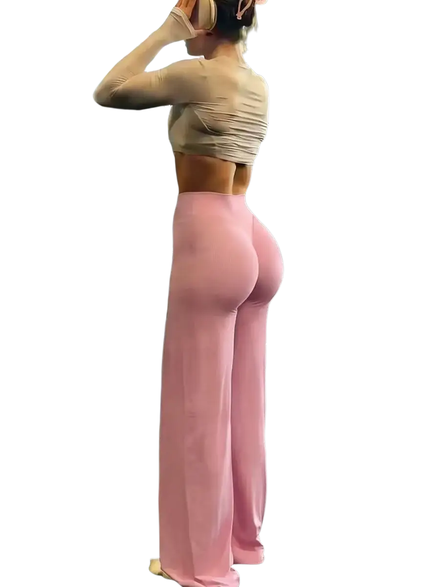 Pink high-waisted wide leg workout leggings made from stretchy fabric designed for fitness and casual wear