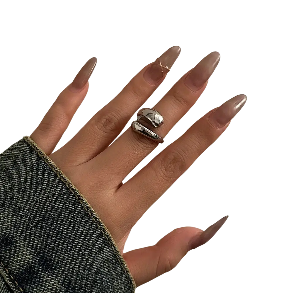 Silver color chunky metal bangle ring with sleek modern minimalist design worn on the middle finger