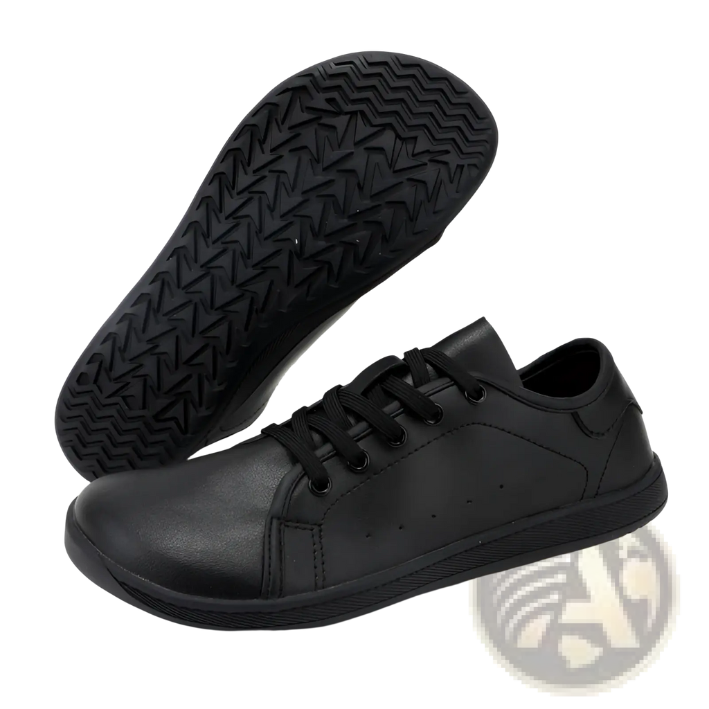 Black leather wide toe low-top sneaker with textured rubber sole and matching laces minimalist non slip design
