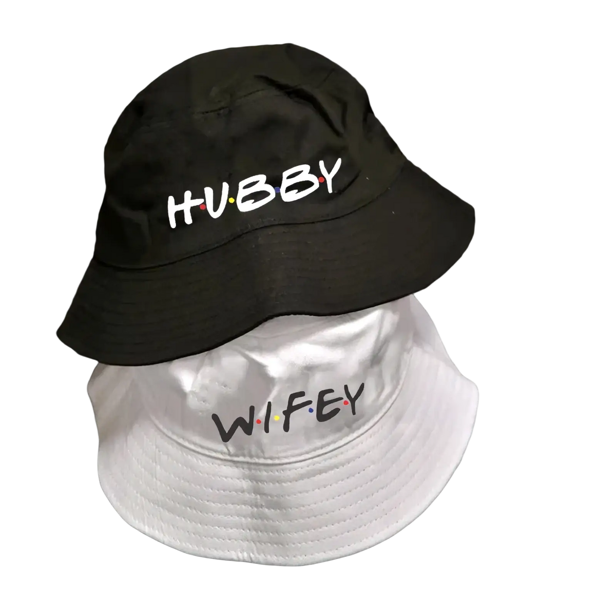 Black and white cotton bucket hats with embroidered hubby and wifey text in friends themed font for weddings