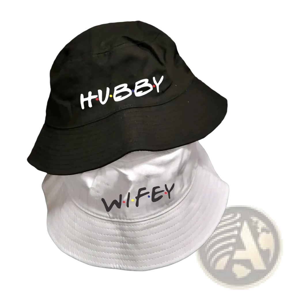Black and white cotton bucket hats with embroidered hubby and wifey text in friends themed font for weddings