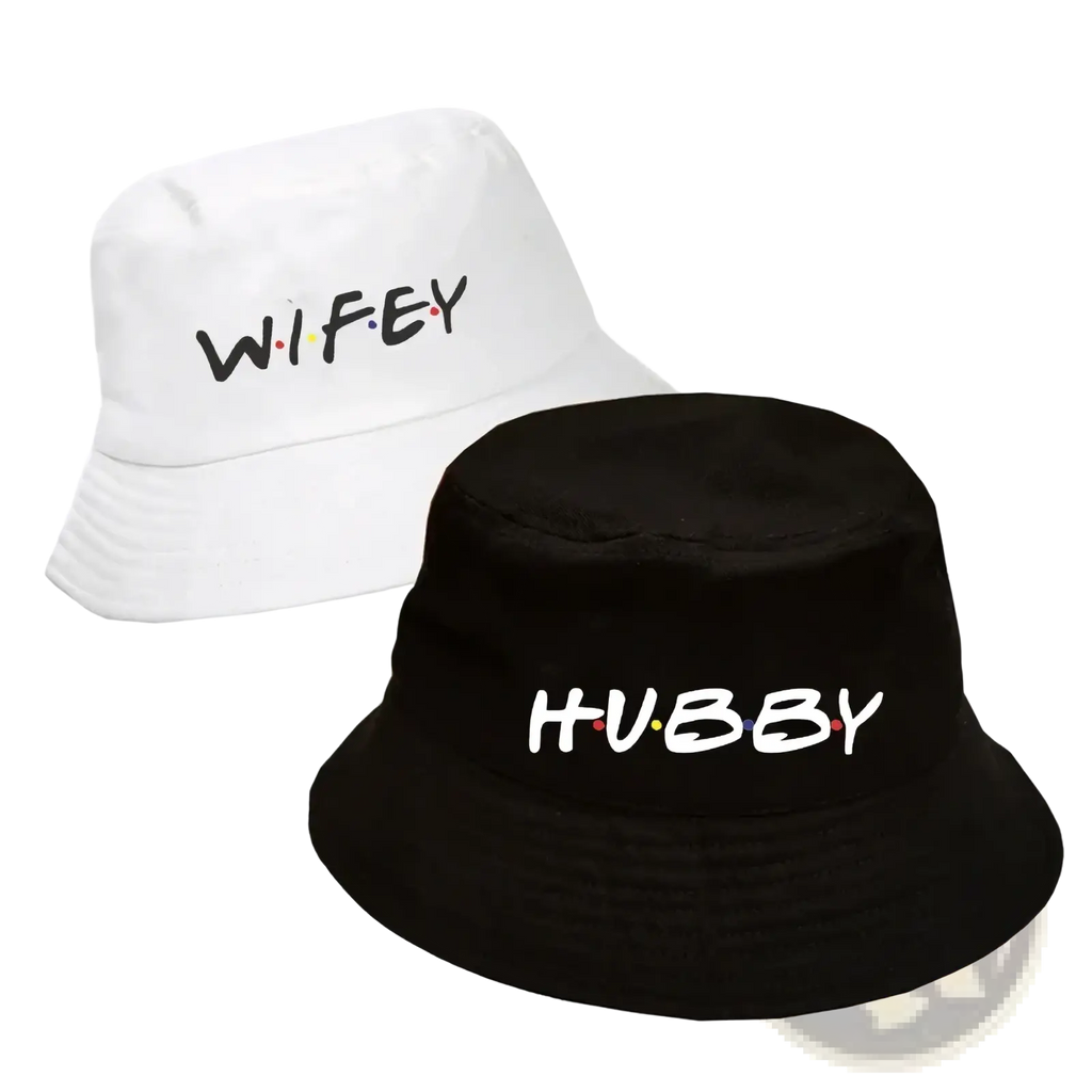 White and black cotton bucket hats with wifey and hubby text in colorful dots for friends themed weddings